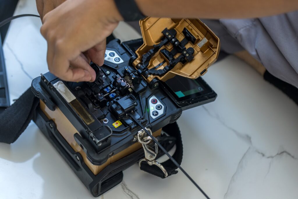 Optical fiber installation with Digital Fiber Optical Fusion Splicing machine.