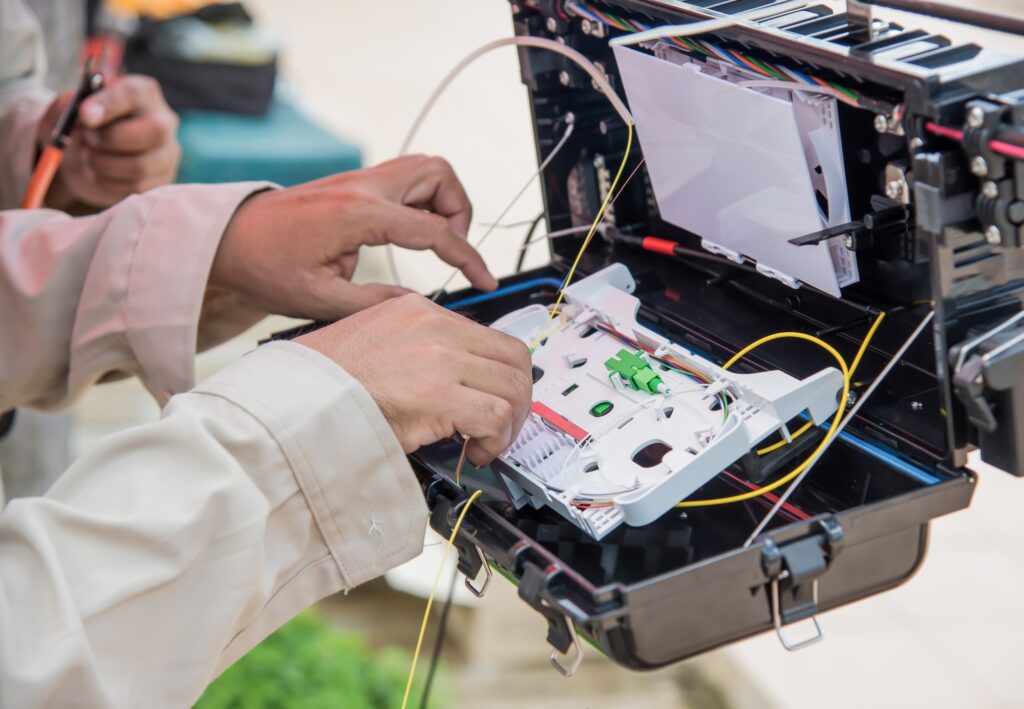 Technicians are installing fiber optic cabinets.